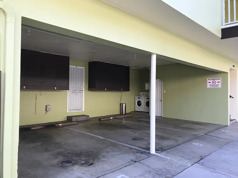One assigned, covered carport parking space has quick access to the rear entry door. Two assigned, storage wall cabinets are conveniently provided in the covered carport area.