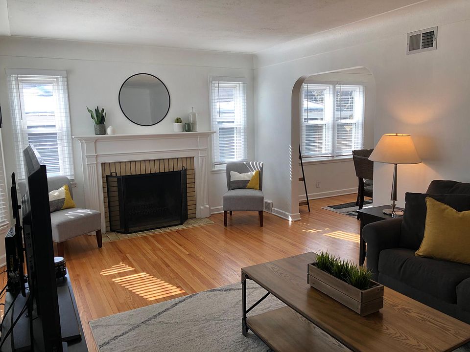 Living room with wood fireplace.