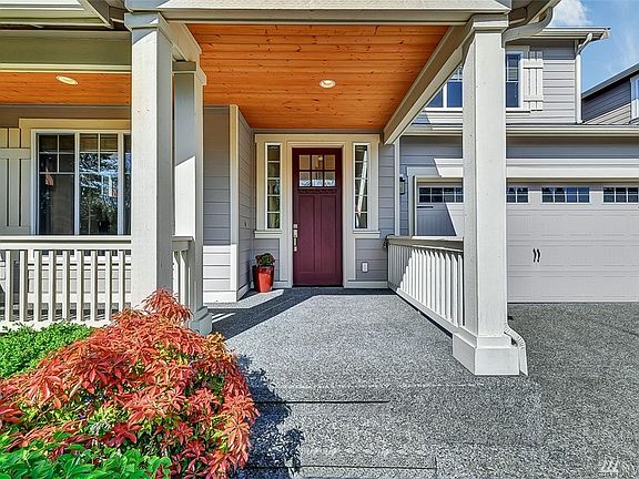 East facing front door! Plenty of porch space for a chair and table. 