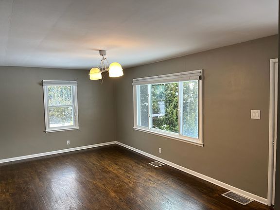 Beautiful hardwood floors and with views of lush landscaped yard.