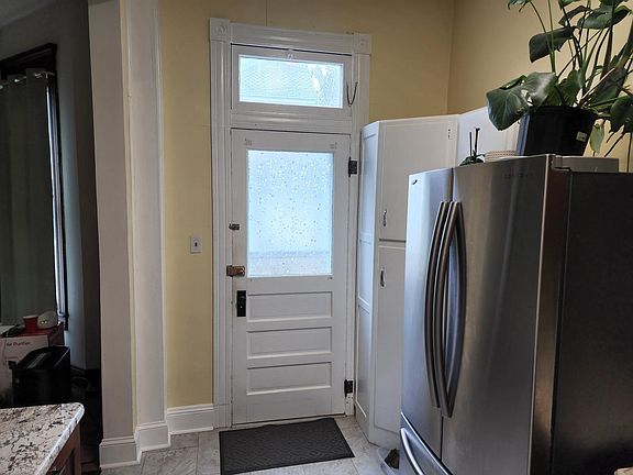 Kitchen with view of back door