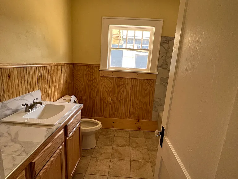 Remodeled bathroom looking south from hall doorway.