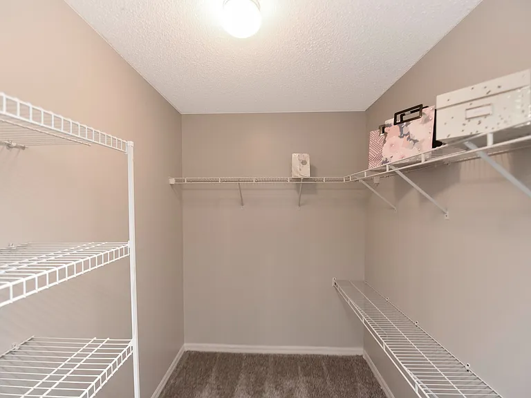 Experience abundant storage with this elegant walk-in closet.