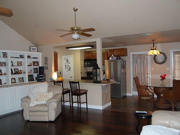 Open concept, dining, kitchen and living room with tile bar.