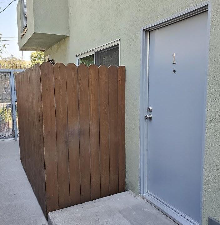 Unit front entrance and fenced private patio