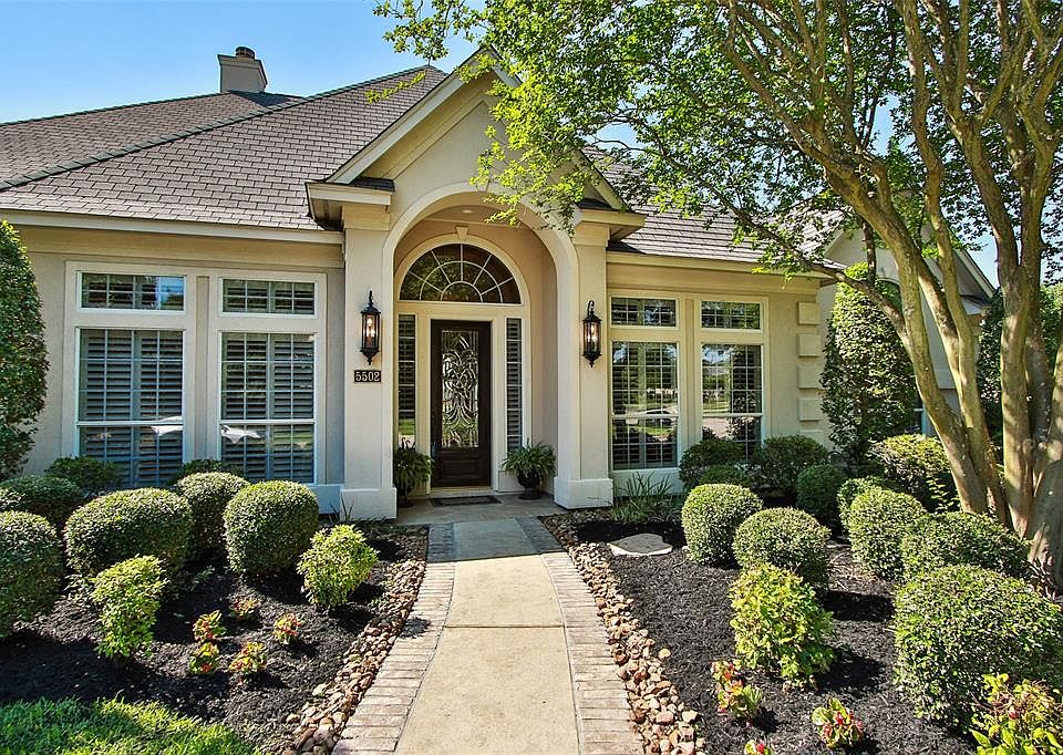 Gorgeous landscaping is the perfect setting for this beautiful home