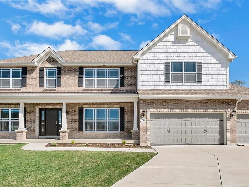 Craftsman style home sporting a brick exterior w/ stone & shake style accents, prairie style window grilles and a large covered front porch. Lawn has an irrigation system, will accommodate a pool and backs to a private tree line.