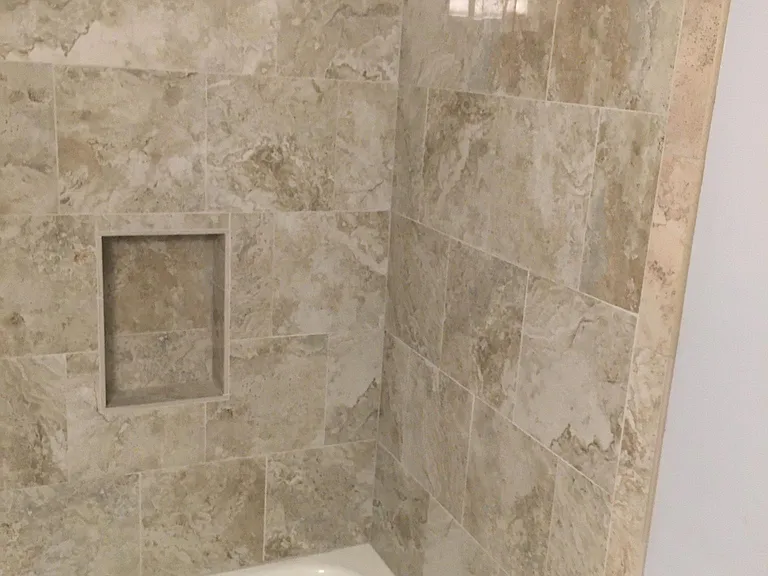 All new polished porcelain bath surround with oval shower curtain rod.