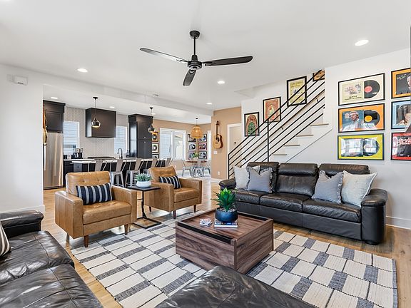 Modern, cozy living room with a gas fireplace, sleeper sofa and a Smart TV with all the streaming apps.