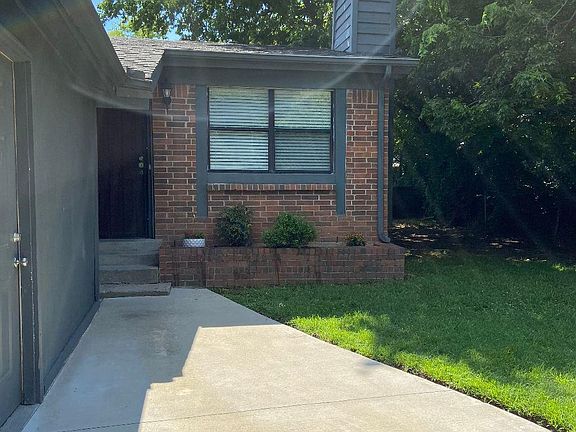 Front entry sidewalk from garage side door.