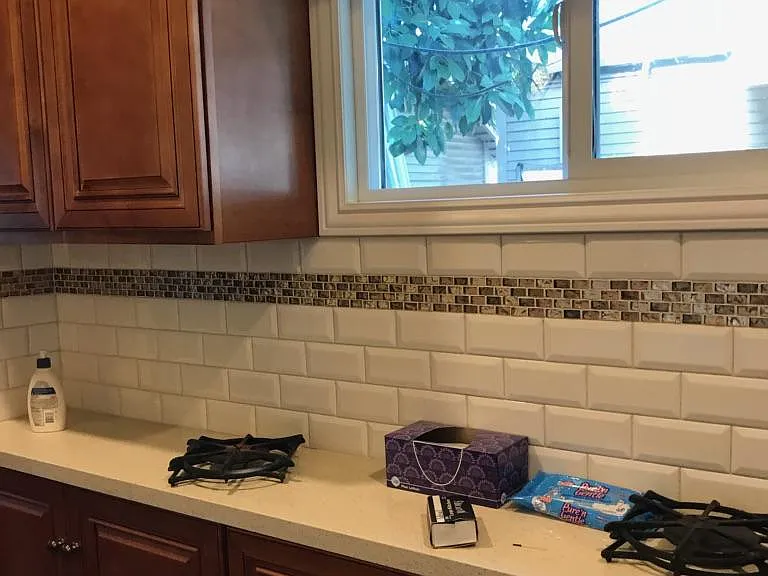 same as previous photo except for view of cabinetry all along underneath of right counter top
