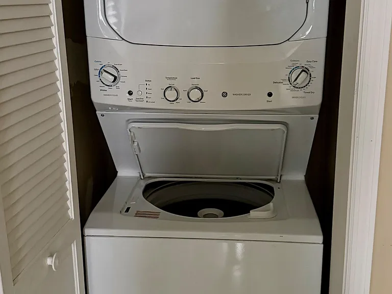 In-unit stacked washer and dryer tucked into a dedicated closet for convenient, everyday laundry access.