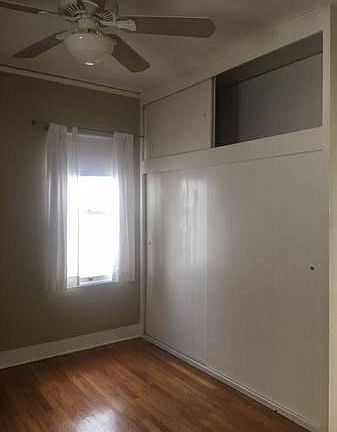 Bedroom with double wide closet and bonus storage above.