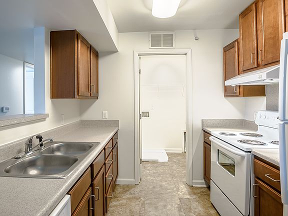 Cook with confidence in a well-equipped kitchen featuring generous counter space and abundant cabinet storage.