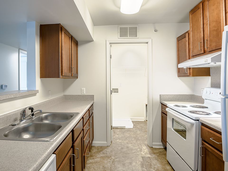 Cook with confidence in a well-equipped kitchen featuring generous counter space and abundant cabinet storage.