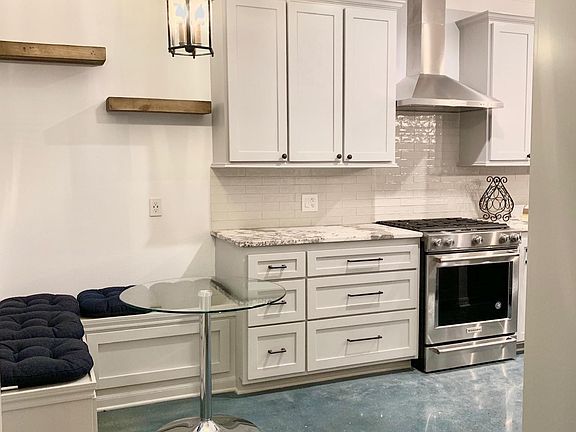 built-in breakfast nook to enjoy your morning coffee next to the window facing the side patio.