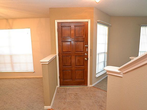 Entry offering tile flooring and access to a half bath.