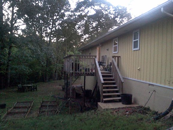 Big back yard with deck overlooking forest and pastureland's