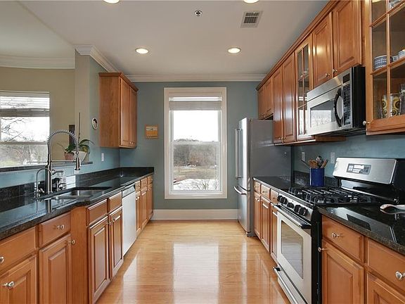 Granite kitchen with sleek stainless appliances.