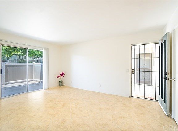 Large living room with tile flooring