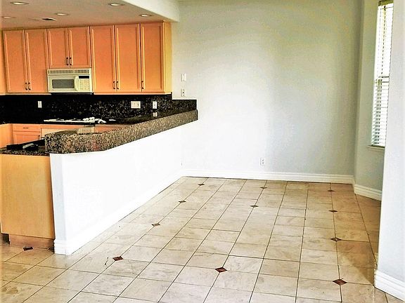 Breakfast nook off of kitchen and breakfast bar.