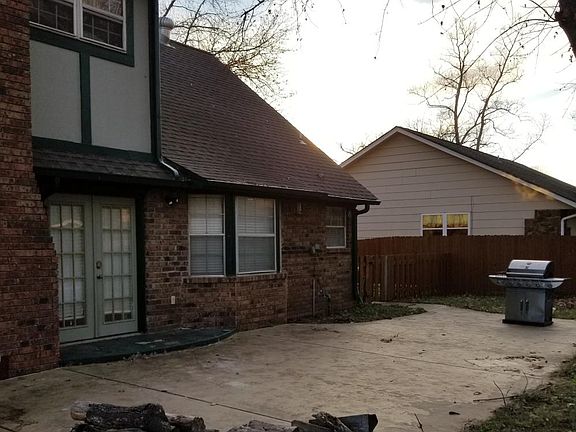 Huge backyard area with spacious patio and grill