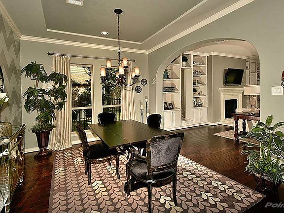 Beautiful Formal Dining has tray ceilings. 13x12