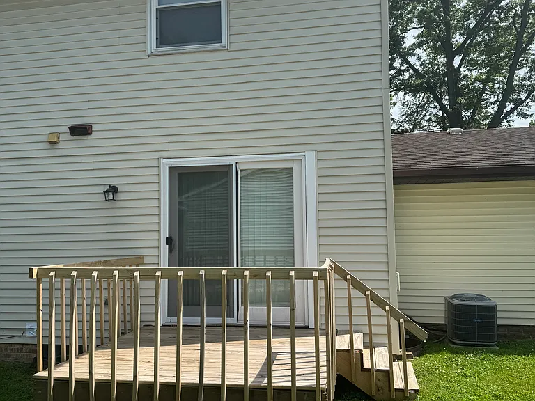 New deck off back of duplex via kitchen