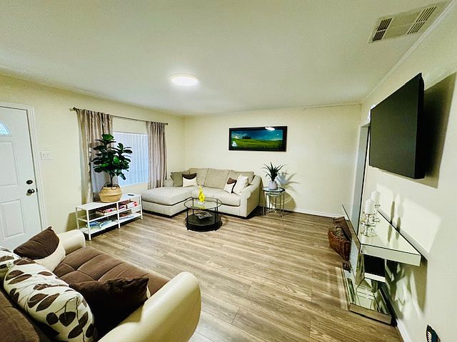 Living room area from bedroom 2 bedroom 3 and bathroom 1