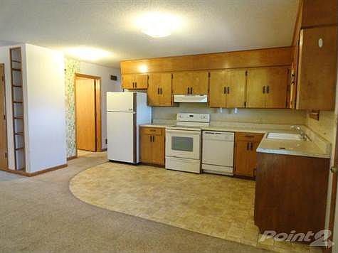 Kitchen with vinyl flooring.