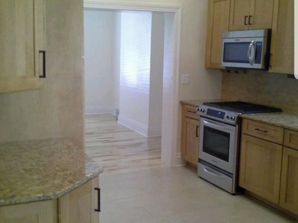 Kitchen looking into living room.