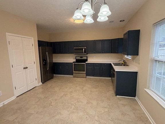Large kitchen with brand new refrigerator