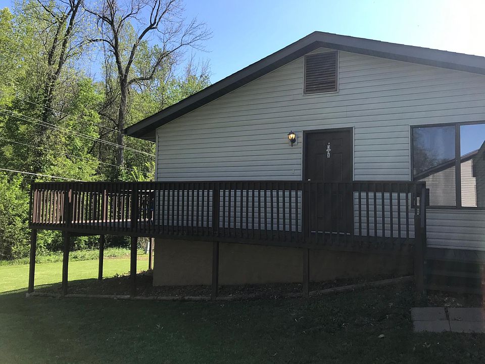 Entrance to 318 Bobbie Dr. Nice large back deck overlooking wooded area.