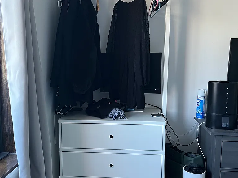 Bedroom drawers also used as standing desk (clothes and books illustrative only)