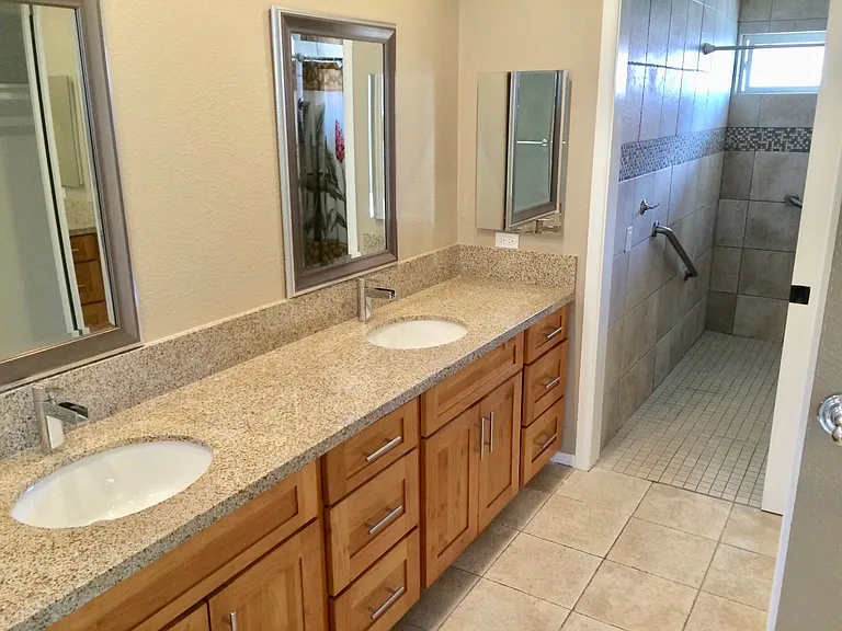 Master bathroom with double sinks.