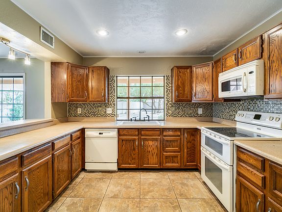 4th image of 9839 N 54th Ave
