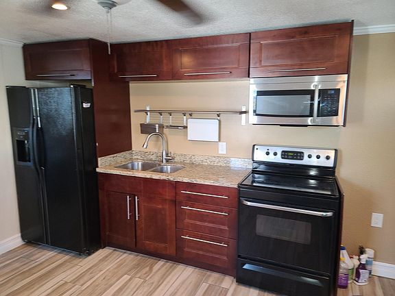quality kitchen with all pots, pans, silverware, and dishes