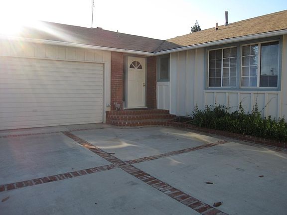 Newer garage door with remote control, washer and dryer in gar