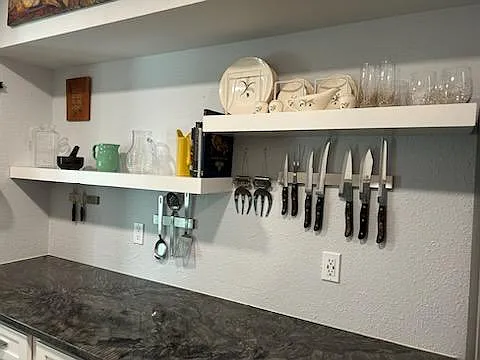 Open shelving. Strong magnets hold knives and utensils in easy reach. Smart outlets with usb ports