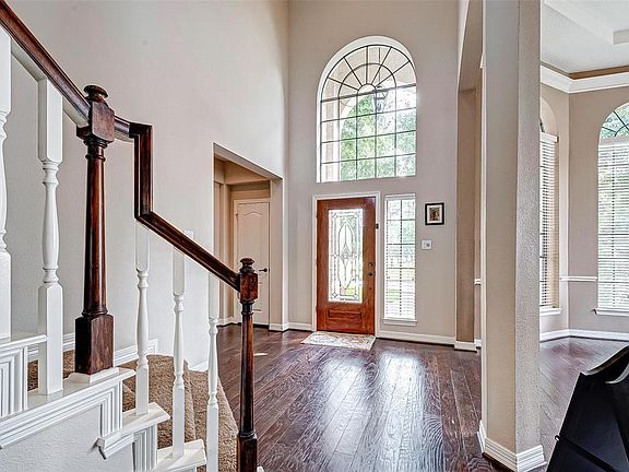 Tons of natural lighting with stunning wood floors enhance the beauty of this home.