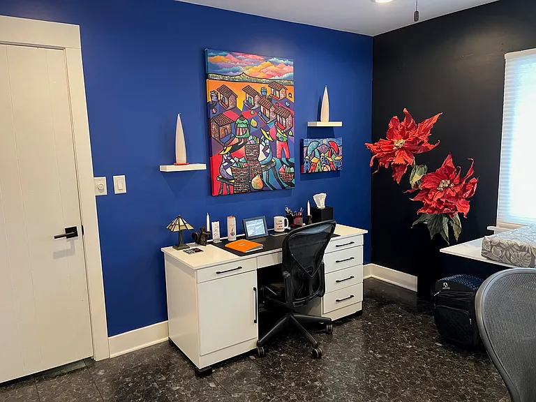 flex room with work desk and drop-down shelf under window