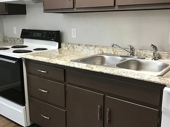 Kitchen with new floors, countertops, sink and dishwasher