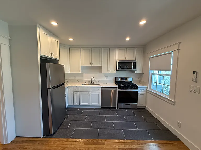HUGE CHEF'S KITCHEN WITH ALL NEW STAINLESS STEEL TOP BRAND APPLIANCES, NEW CABINETS, SLATE TILE FLOOR AND STAINLESS STEEL UNDERMOUNT SINK