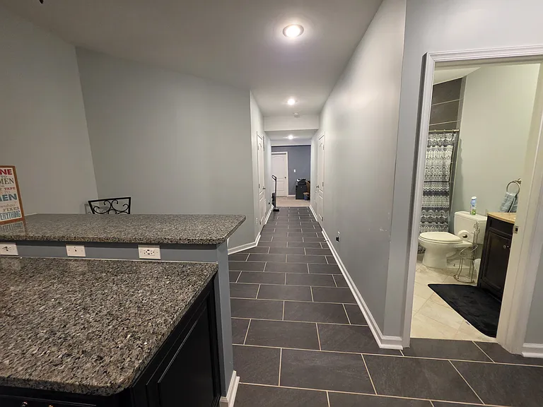 Basement hallway view from the Kitchen