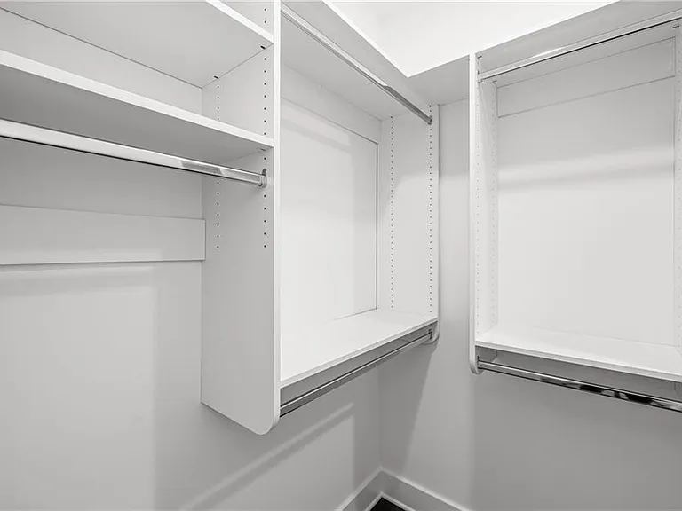 Main Bedroom Closet 2 (Walk In) (Note: Actual unit has light wooden floors and upgraded fixtures / appliances)