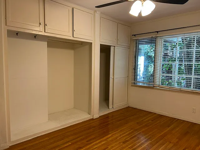 Enjoy a full wall of closets and storage cabinets in the bedroom. Ceiling fan with remote control.