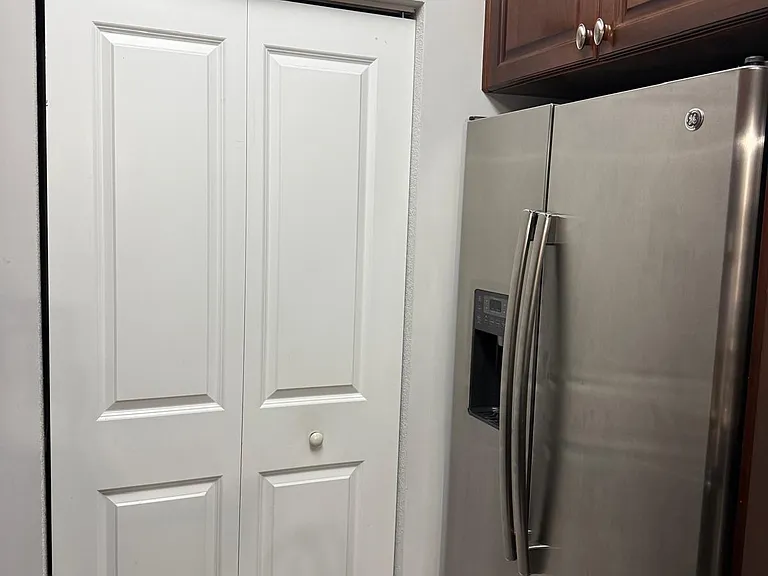 GE Orofile Side By Side Refrigerator ice& water in door; Laundry room