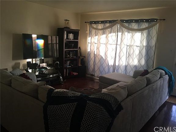 Living room with large, beautiful window that has a view of the backyard!