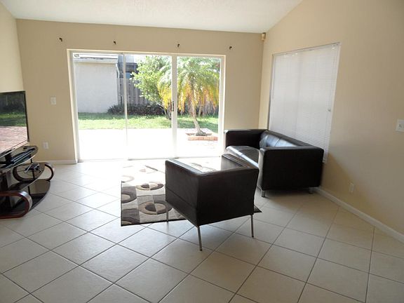 large living room with sliding doors to patio