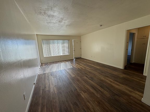 Expansive living room with door to bedrooms and bath on right